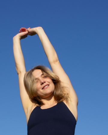 marie with hands in the sky